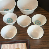 White Mixing Bowls, Framed Monaco Print, Hat, and Decorative Metal Pieces - thumbnail 5 of 7