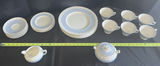 Blue and White Dinnerware Set with Plates, Cups, Teapot, and Creamer - thumbnail 1 of 12
