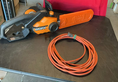 WORX electric chainsaw with blade cover and extension cord - Image 1 of 4