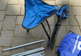 Camping Tent Setup with Poles and Gear - thumbnail 7 of 9