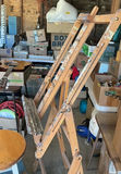 Paint-splattered artist easel with round stool and blue step stool - thumbnail 2 of 3