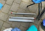 Camping Tent Setup with Poles and Gear - thumbnail 8 of 9