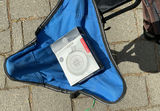 Blue folding camping chairs, trekking poles, and brown backpack - thumbnail 3 of 7