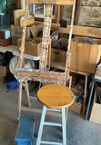 Paint-splattered artist easel with round stool and blue step stool - thumbnail 1 of 3