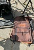 Blue folding camping chairs, trekking poles, and brown backpack - thumbnail 4 of 7