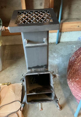 Metal freestanding Rocket stove with top grate and ash drawer - Image 1 of 5
