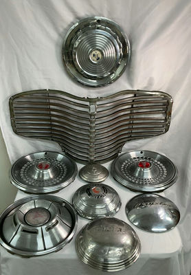 Vintage chrome car hubcaps and grille pieces - Image 1 of 8