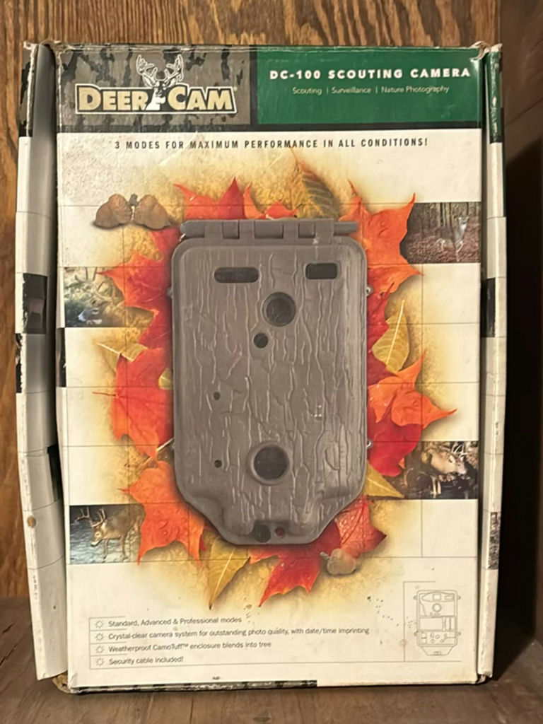 Wildlife trail cameras and timer accessories in boxes - image 1 of 6