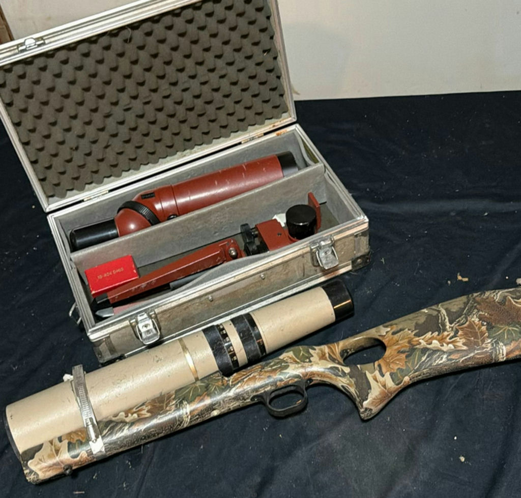 Camouflaged hunting rifle with spotting scope and accessories - image 1 of 6