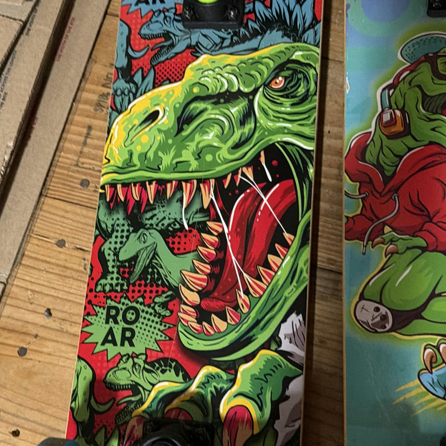 2 Madd Gear skateboards with monster and dinosaur graphics - image 7 of 9