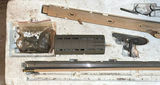 Disassembled firearm parts with wooden stocks and metal components - thumbnail 2 of 5