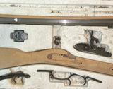 Disassembled firearm parts with wooden stocks and metal components - thumbnail 5 of 5
