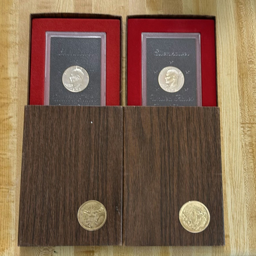 2 Eisenhower dollar coins in display boxes - image 1 of 6