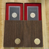2 Eisenhower dollar coins in display boxes - thumbnail 1 of 6