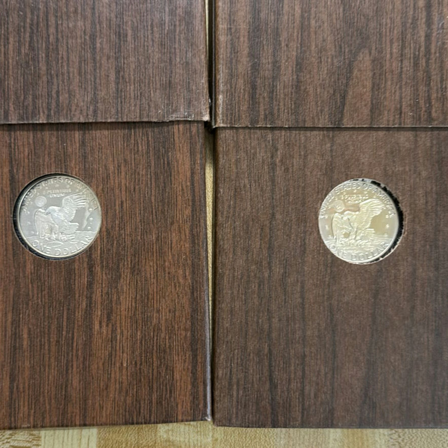 2 Eisenhower dollar coins in display boxes - image 4 of 6