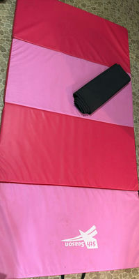 Pink and red folding gym mat with carrying strap - Image 1 of 7
