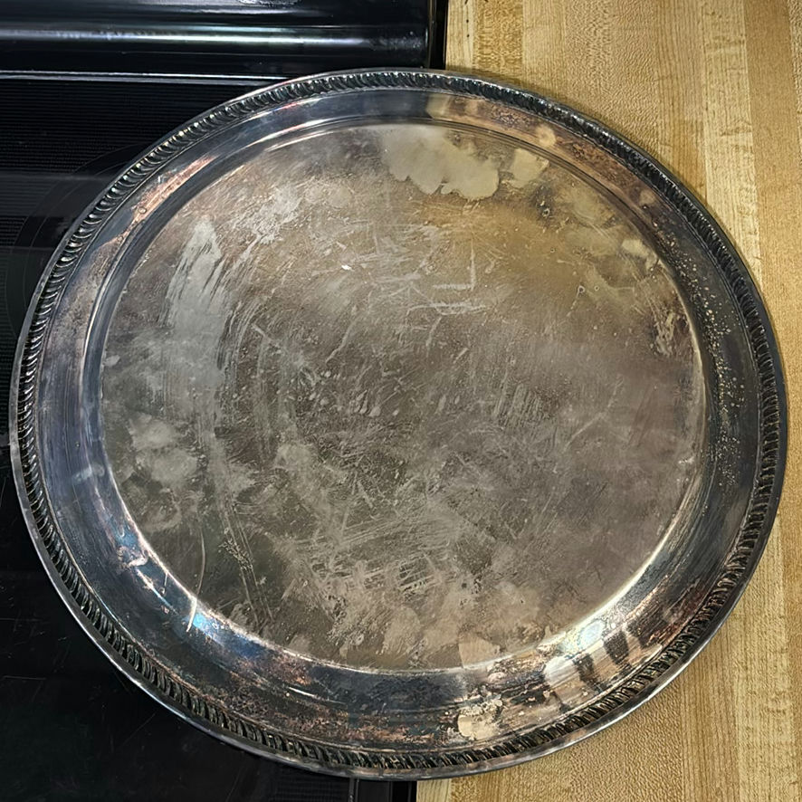 Round engraved metal tray and three-lobed shell-shaped serving platter - image 2 of 4