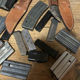 Assorted firearm magazines, holsters, and ammo box - thumbnail 3 of 7