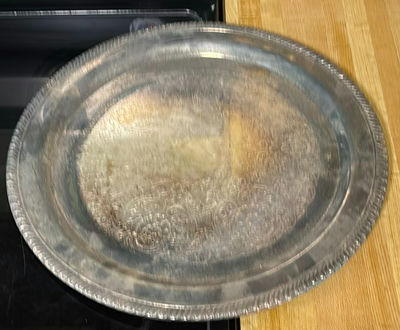 Round engraved metal tray and three-lobed shell-shaped serving platter - Image 1 of 4