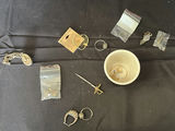 Assorted jewelry and small trinkets including a miniature sword pendant - thumbnail 2 of 5
