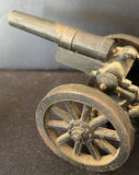 Vintage metal toy cannon with wheeled carriage - thumbnail 1 of 5
