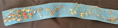 Blue perforated belt with assorted pins - Image 1 of 7