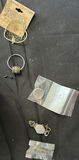 Assorted jewelry and small trinkets including a miniature sword pendant - thumbnail 4 of 5
