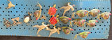 Blue perforated belt with assorted pins - thumbnail 6 of 7