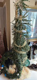 Assorted Christmas decorations: artificial evergreen tree with burlap ribbon, pinecones, poinsettia, nativity display, and cone sculptures - thumbnail 1 of 5