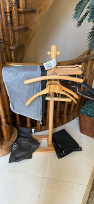 Wooden clothing rack with hangers and garment bags - Image 1 of 3
