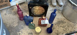 Assorted colored glass bottles and a clock - thumbnail 6 of 6