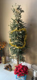 Assorted Christmas decorations: artificial evergreen tree with burlap ribbon, pinecones, poinsettia, nativity display, and cone sculptures - thumbnail 4 of 5