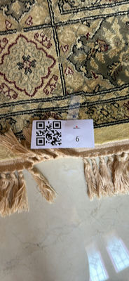 Oriental-patterned area rug with fringed edges - Image 1 of 3
