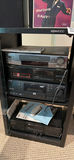 Home entertainment electronics stack with VHS tapes and vinyl - thumbnail 2 of 6
