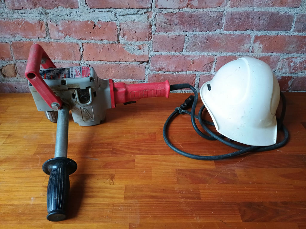 Milwaukee Hole Hawg electric drill with safety helmet - image 1 of 4