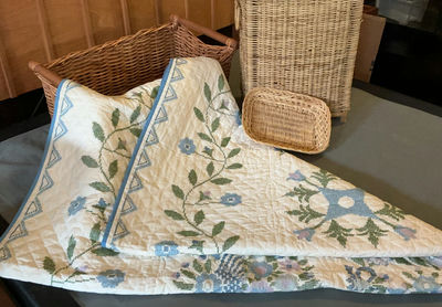 Hand Stitched Embroidered Quilt, Two Wicker Baskets . - Image 1 of 4