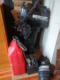 Mercury outboard motor with gas can and battery - thumbnail 1 of 4