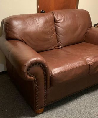 Brown Faux Leather Loveseat, brass stud trim - Image 1 of 8