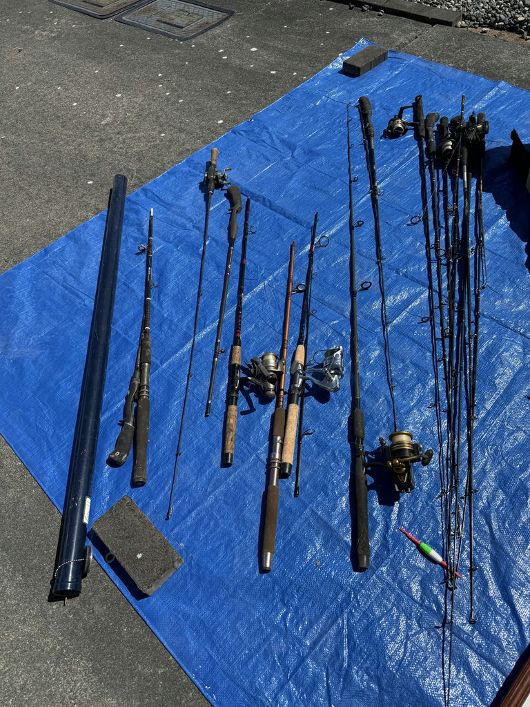 Collection of fishing rods, reels, and tackle - image 10 of 14