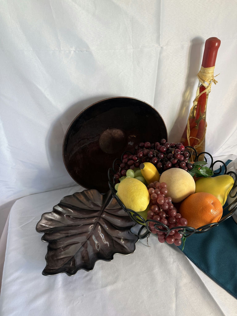 Still-life arrangement with ceramic tureen, fruit basket, and decorative bottles - image 2 of 4