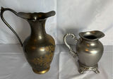 Two decorative metal pitchers with floral motifs - thumbnail 1 of 6