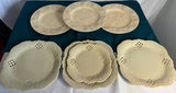 Cream ceramic plates with pineapple-border rims and scalloped-edge plates - thumbnail 1 of 5
