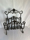 Ornate black iron magazine rack, decorative lampshade, and curved curtain rod - thumbnail 2 of 4