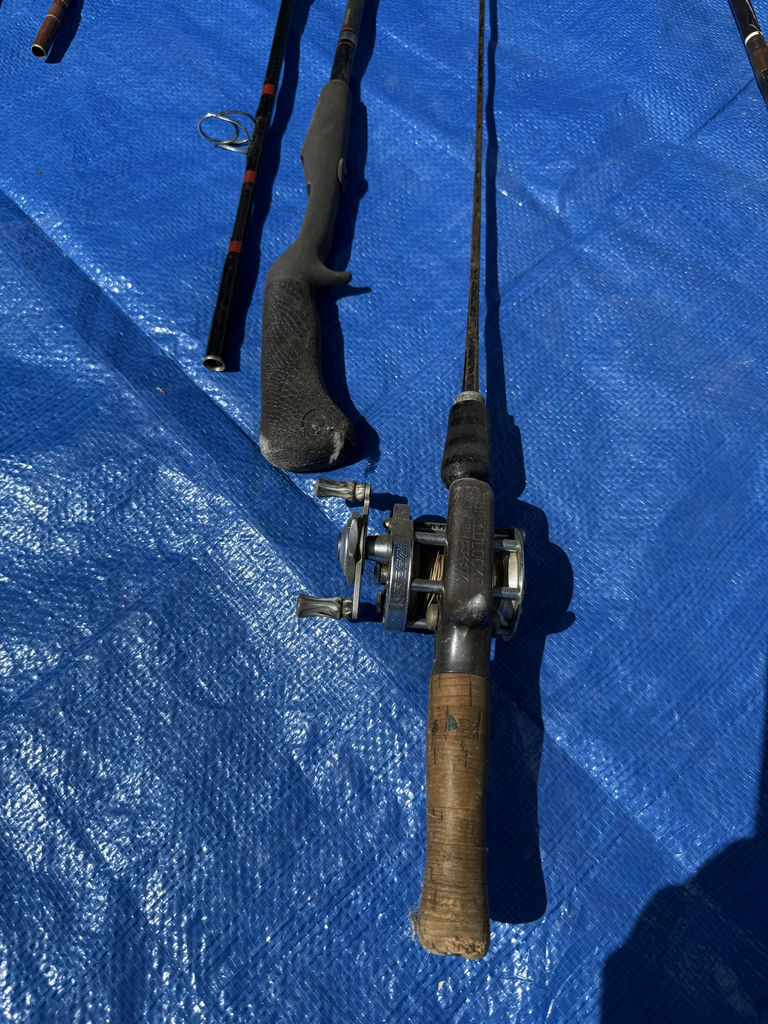 Collection of fishing rods, reels, and tackle - image 13 of 14