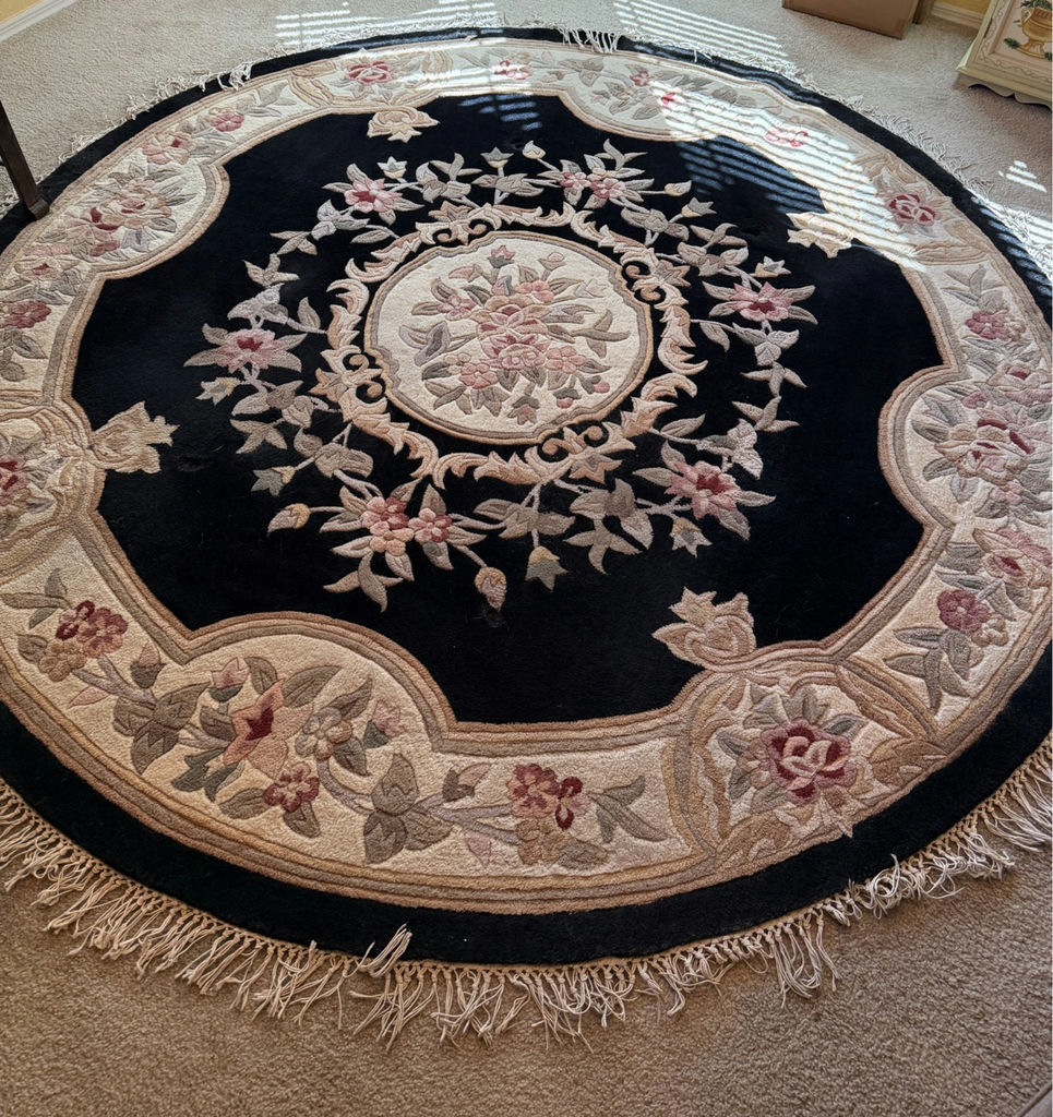 Round wool rug with central medallion and floral border - image 1 of 3