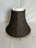 Ornate black iron magazine rack, decorative lampshade, and curved curtain rod - thumbnail 3 of 4