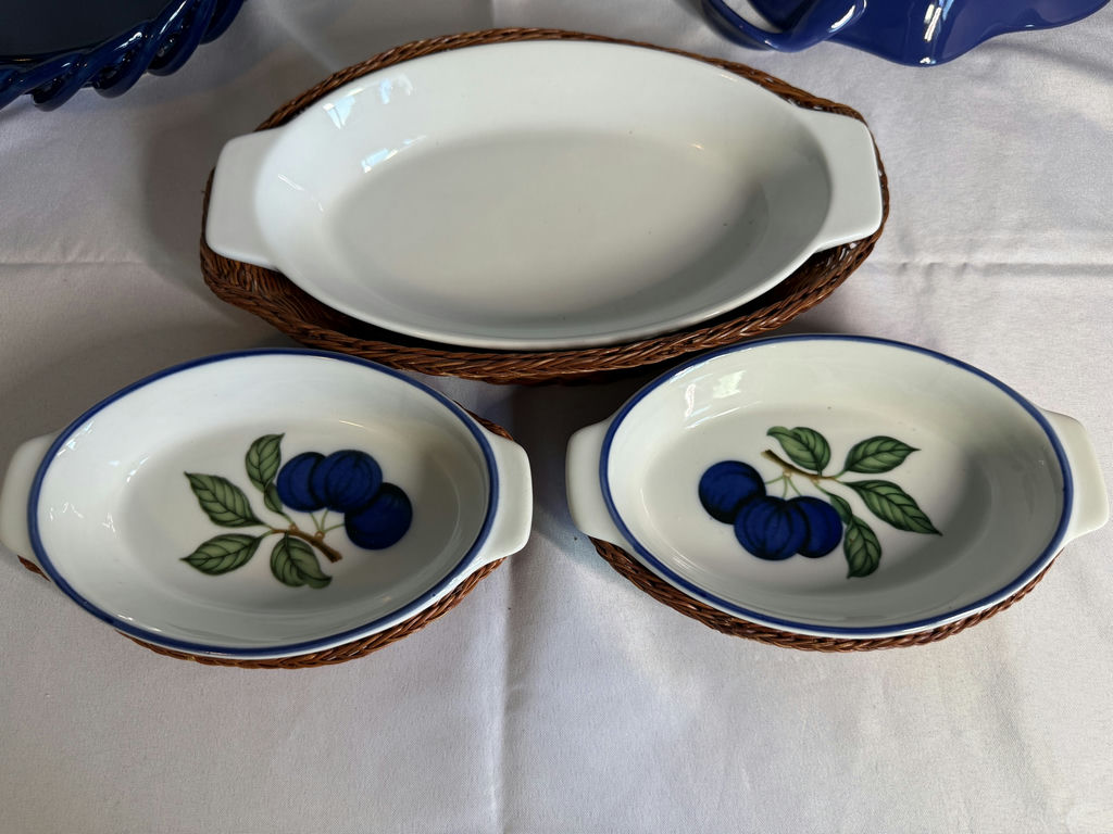 Blue ceramic bakeware set with yellow floral planter and cherry-pattern dishware - image 6 of 7