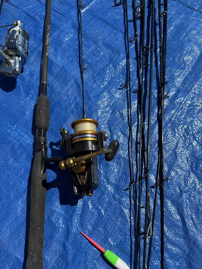 Collection of fishing rods, reels, and tackle - image 12 of 14