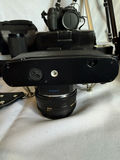 Assorted cameras, lenses, flash, and tripods - thumbnail 5 of 16