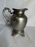 Two decorative metal pitchers with floral motifs - thumbnail 5 of 6